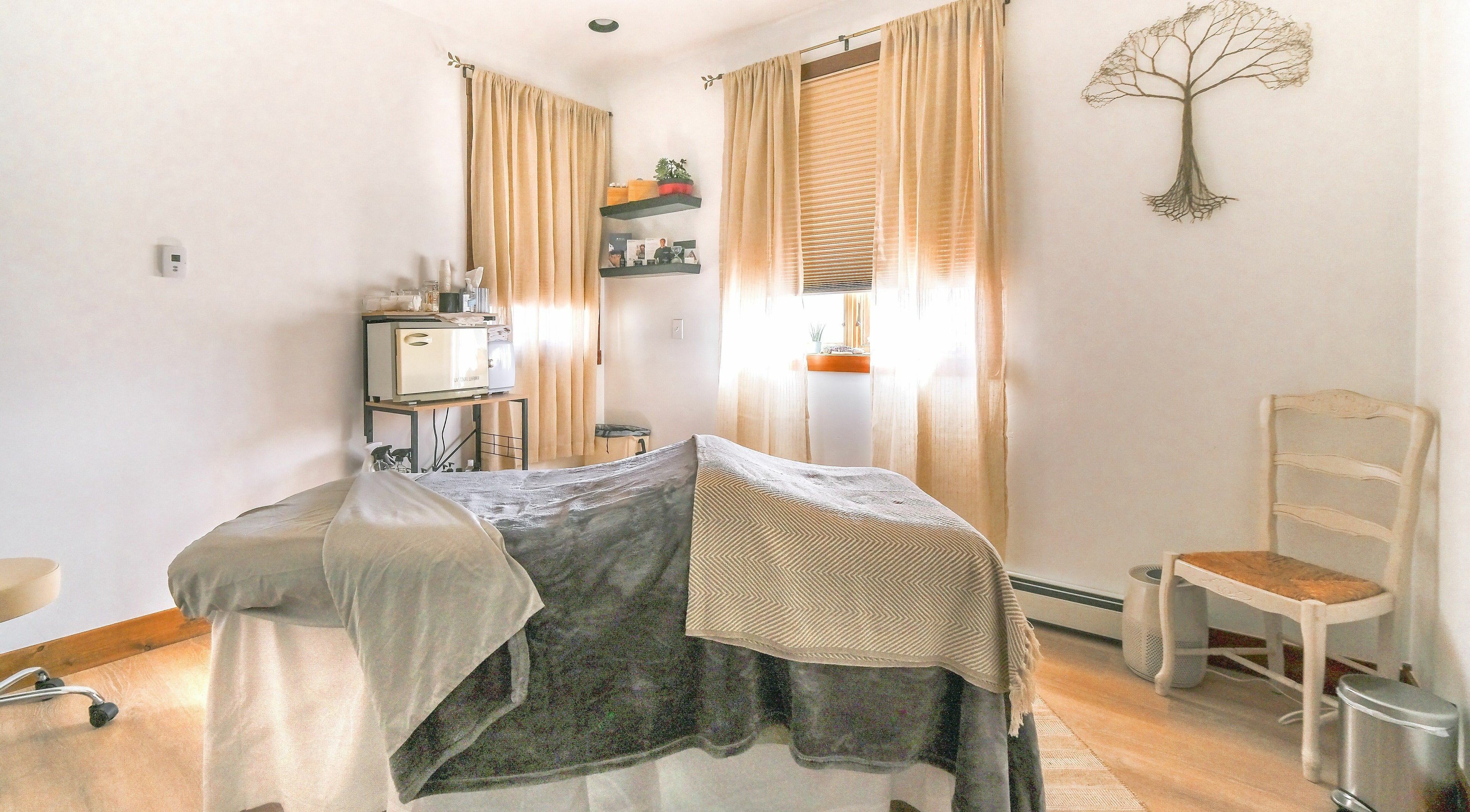 Cozy spa room at Grand Pearl Aesthetics and Wellness, LLC in Fraser, Colorado, US, with soft lighting and decor.