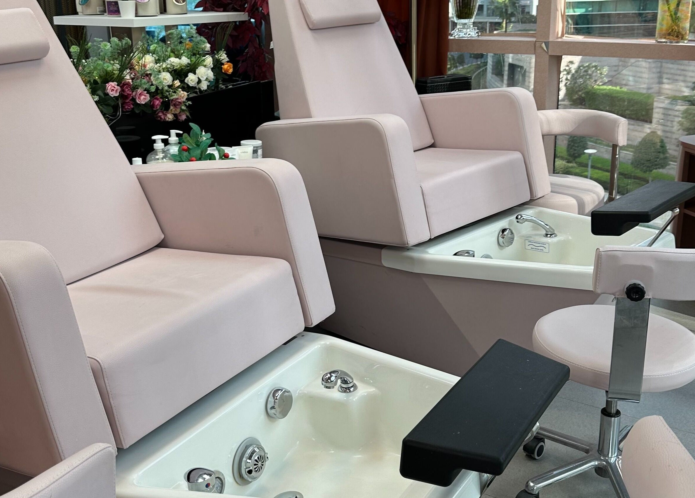 Luxurious pedicure chairs at Juan Salon, Dubai, AE, offering comfort and relaxation.