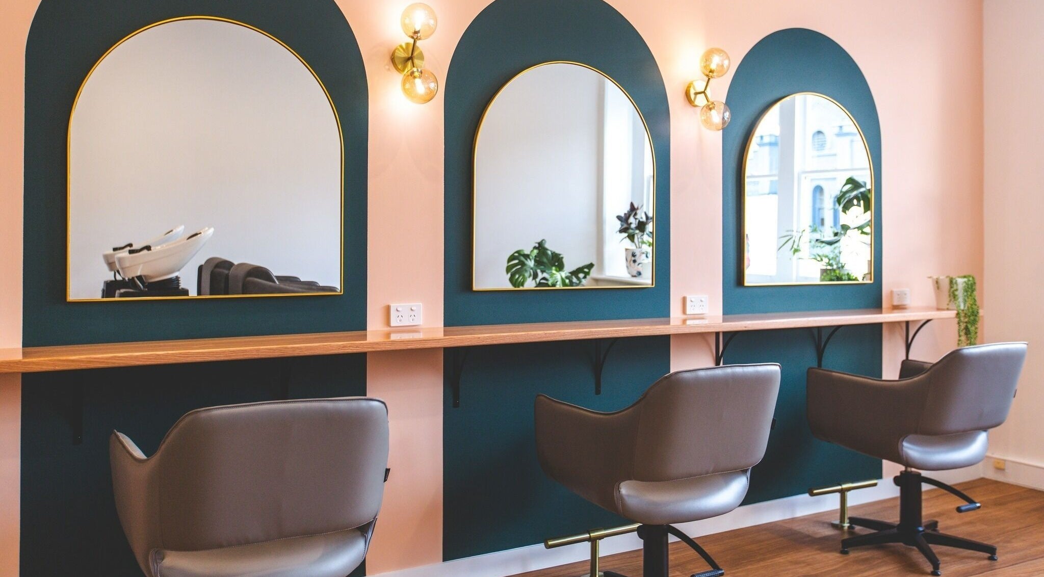 Elegant salon interior at Original Collective in Hobart, Tasmania, AU with stylish mirrors and seating.