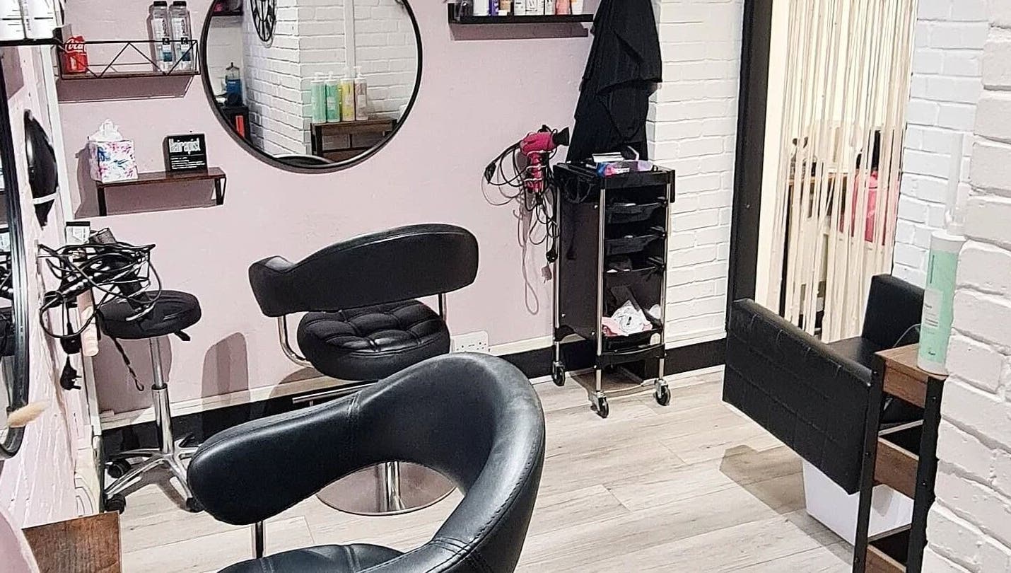 Chic beauty salon interior at Glow & Co. | Brows And Beauty, Wallingford, England, GB with stylish seating.