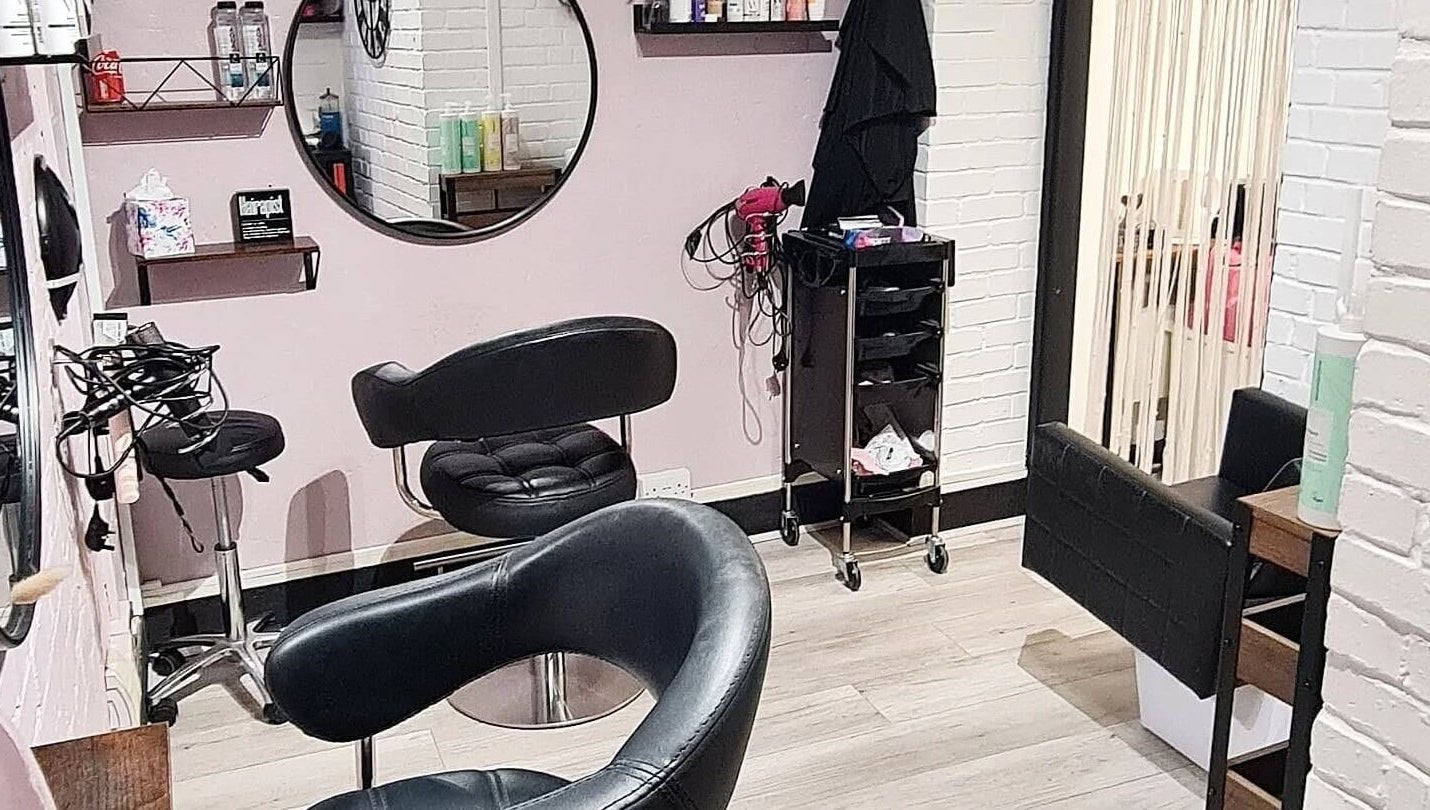 Chic beauty salon interior at Glow & Co. | Brows And Beauty, Wallingford, England, GB with stylish seating.