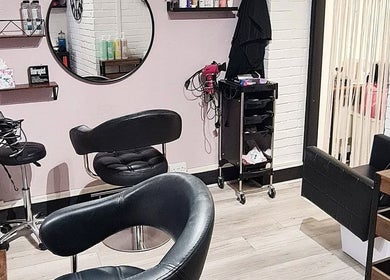 Chic beauty salon interior at Glow & Co. | Brows And Beauty, Wallingford, England, GB with stylish seating.