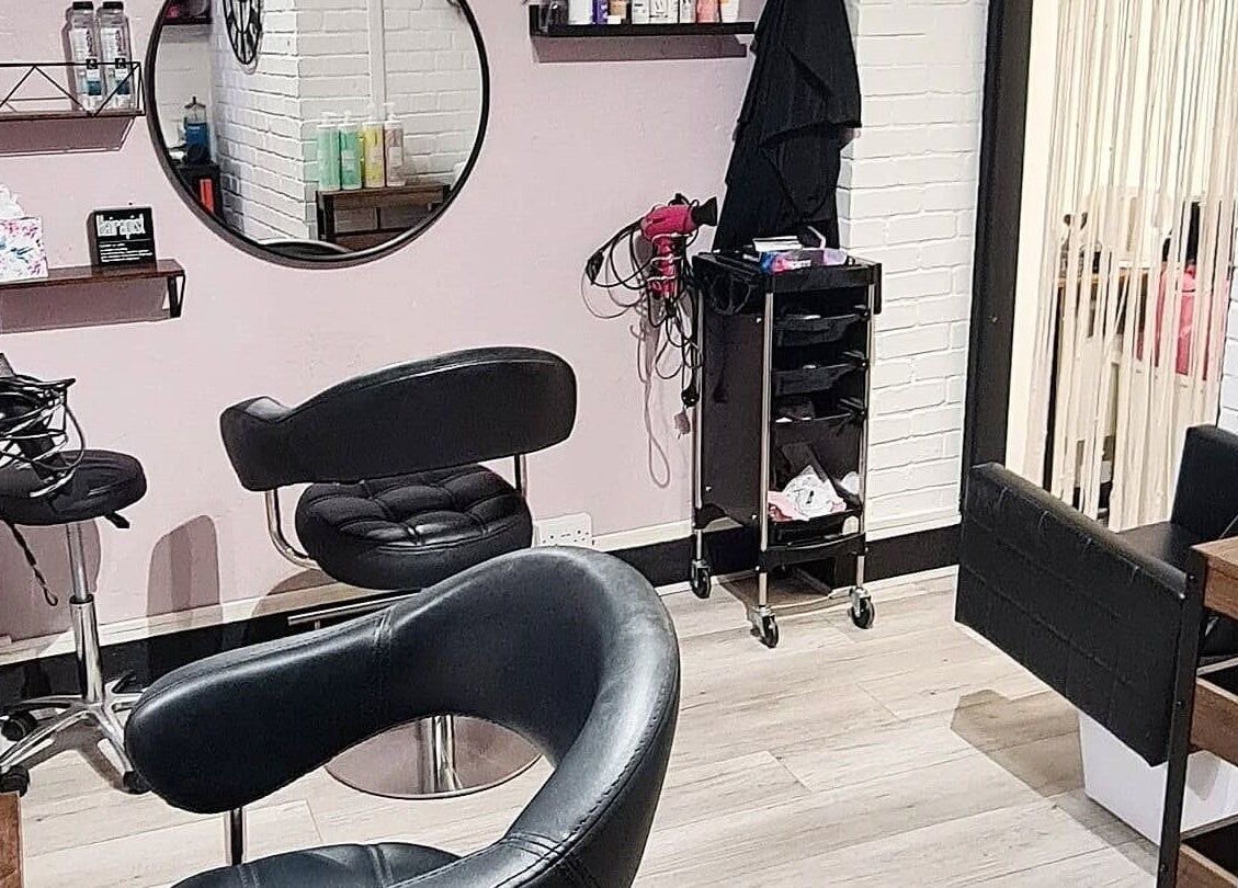 Chic beauty salon interior at Glow & Co. | Brows And Beauty, Wallingford, England, GB with stylish seating.