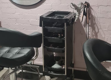 Modern styling station at Glow & Co. | Brows And Beauty, Wallingford, England, GB, featuring sleek chairs and tools.