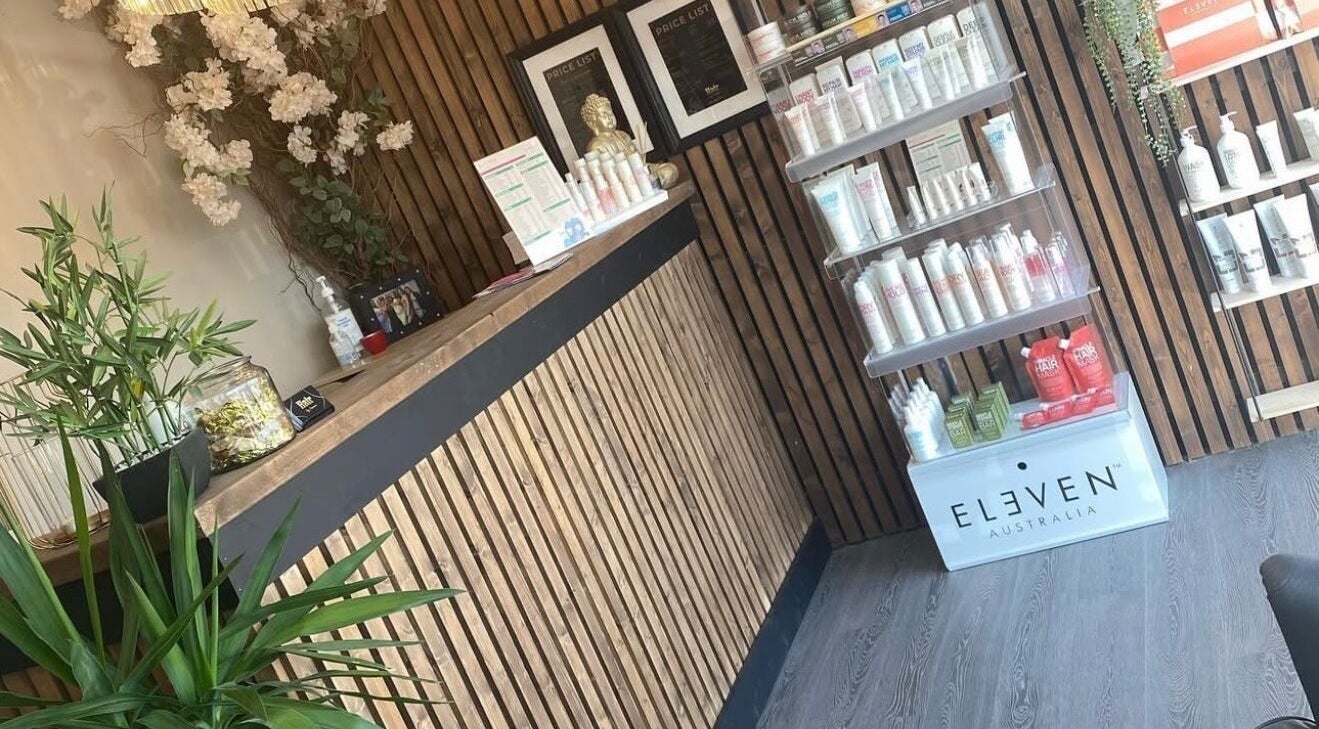 Chic reception with products at Hair by Jasmine, Carrick-On-Shannon, Roscommon, IE. Modern and inviting decor.