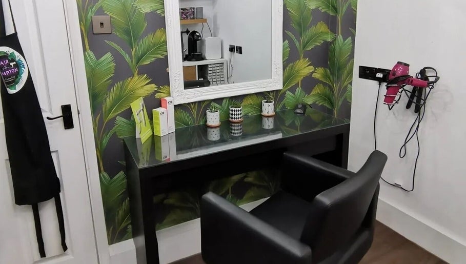 Modern salon setup at Hair at Hampton, Church Crookham, England, GB, featuring chic decor and styling tools.
