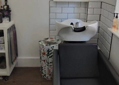 Hair washing station at Hair at Hampton, Church Crookham, England, GB, offering a serene setting.