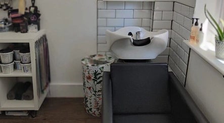 Hair washing station at Hair at Hampton, Church Crookham, England, GB, offering a serene setting.