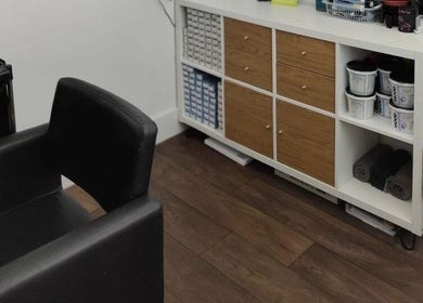 Cozy styling station at Hair at Hampton, Church Crookham, England, GB, featuring modern amenities.