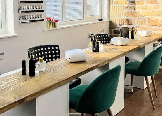 Spacious nail station at Whitehead & Booth Salon & Permanent Jewellery, Sheffield, England, GB, with elegant decor.
