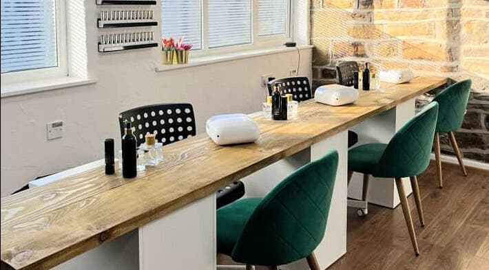Spacious nail station at Whitehead & Booth Salon & Permanent Jewellery, Sheffield, England, GB, with elegant decor.