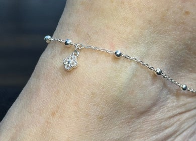 Elegant anklet with charm from Whitehead & Booth Salon & Permanent Jewellery, Sheffield, England, GB.