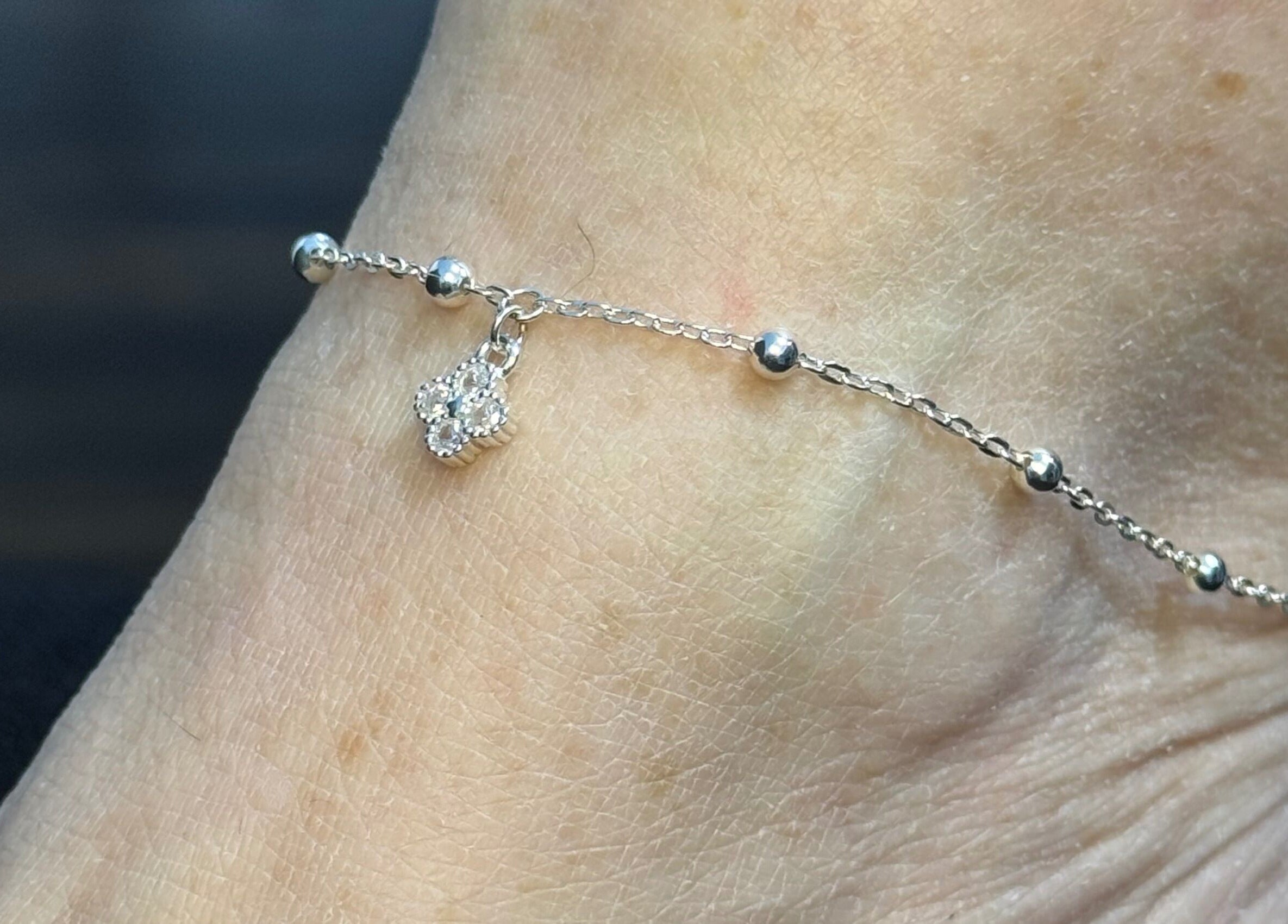 Elegant anklet with charm from Whitehead & Booth Salon & Permanent Jewellery, Sheffield, England, GB.