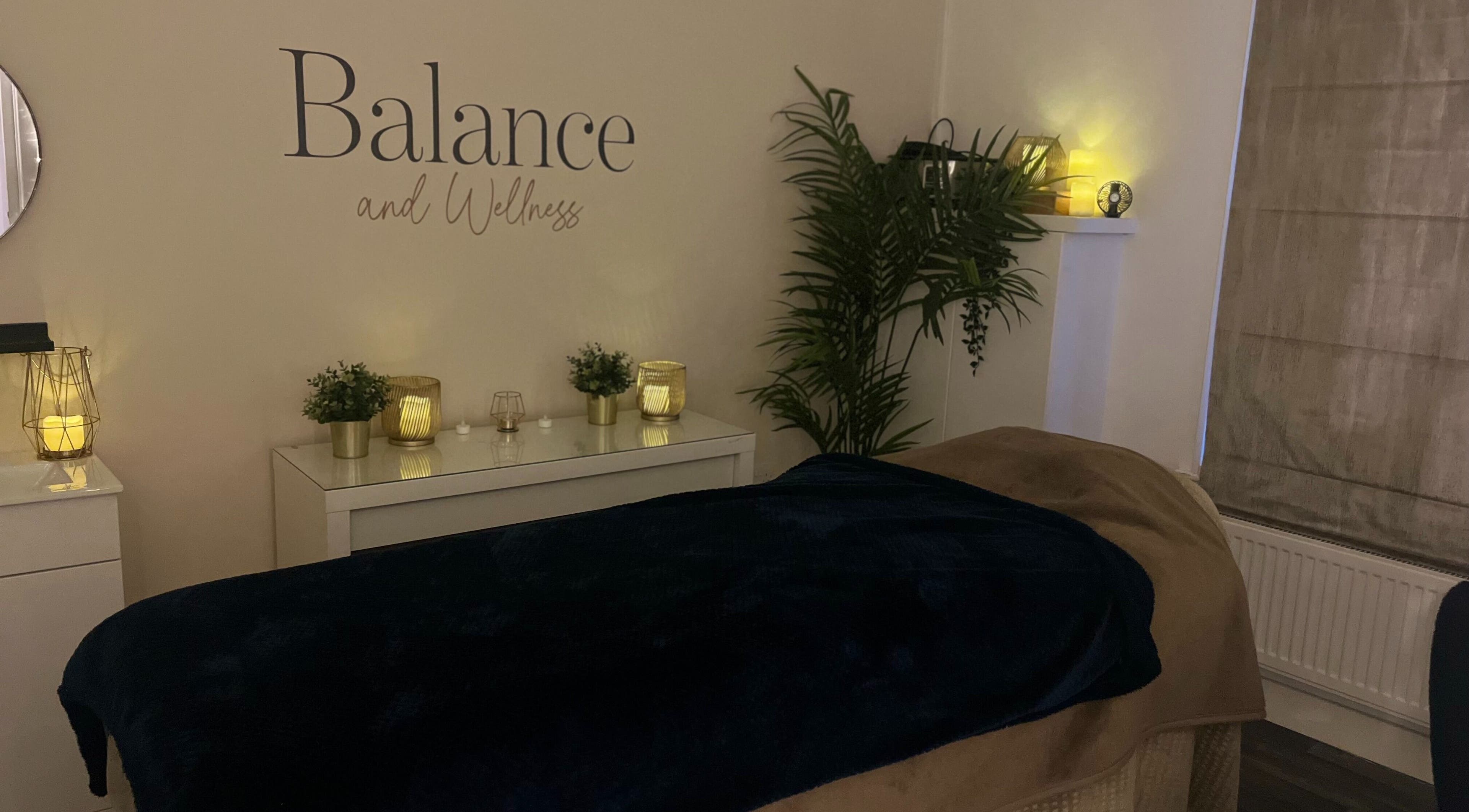 Cozy treatment room at Balance and Wellness, Preston, England, GB with dark blanket and warm ambiance.