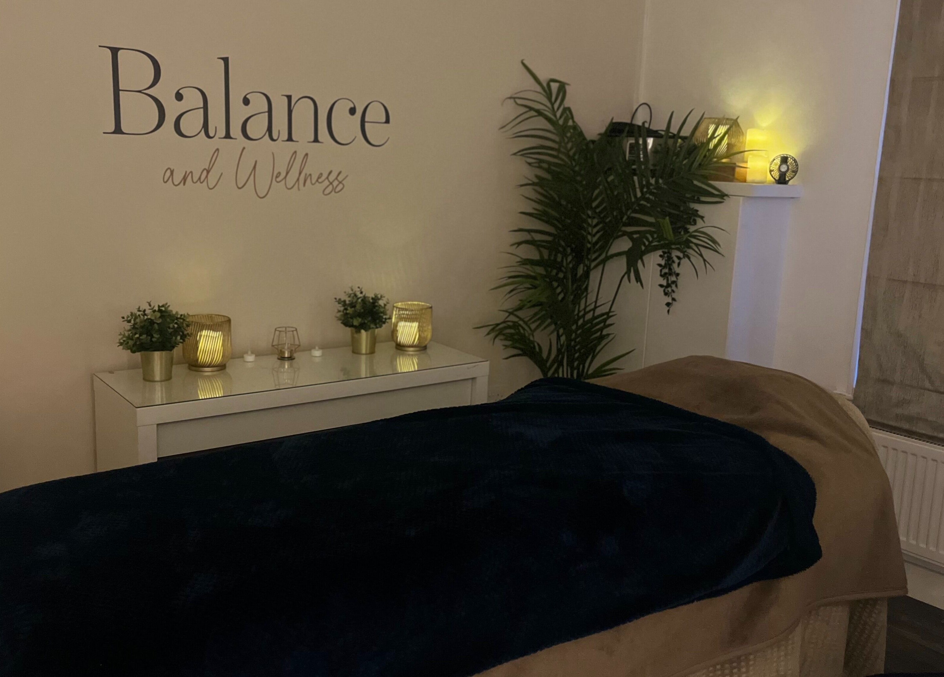 Relaxing treatment room at Balance and Wellness, Preston, England, GB with soothing decor and ambient lighting.