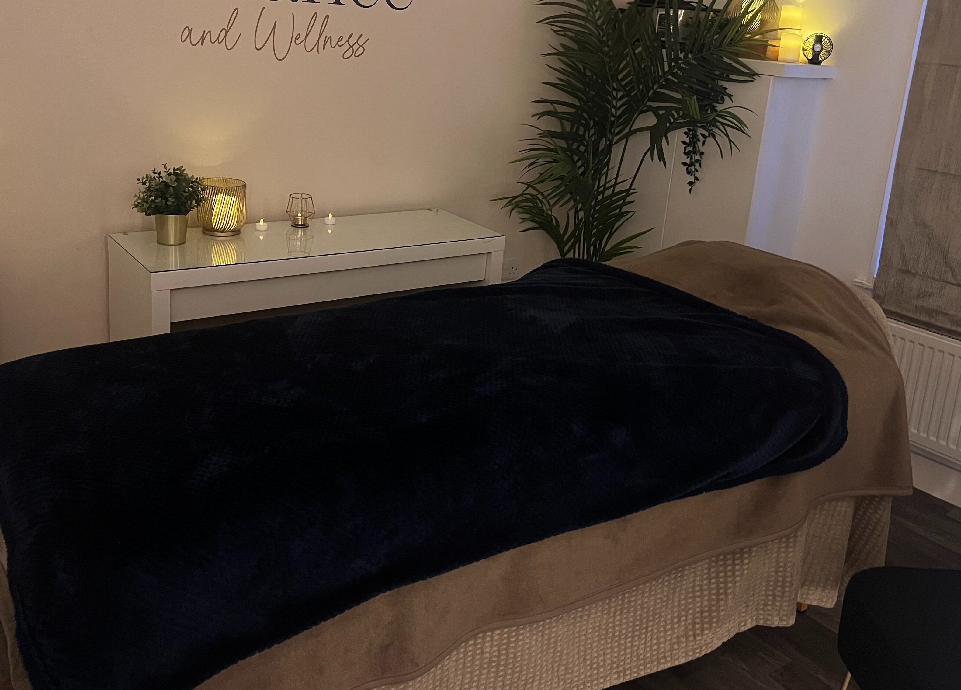 Relaxing spa room at Balance and Wellness, Preston, England, GB, featuring a cozy treatment bed and ambient lighting.