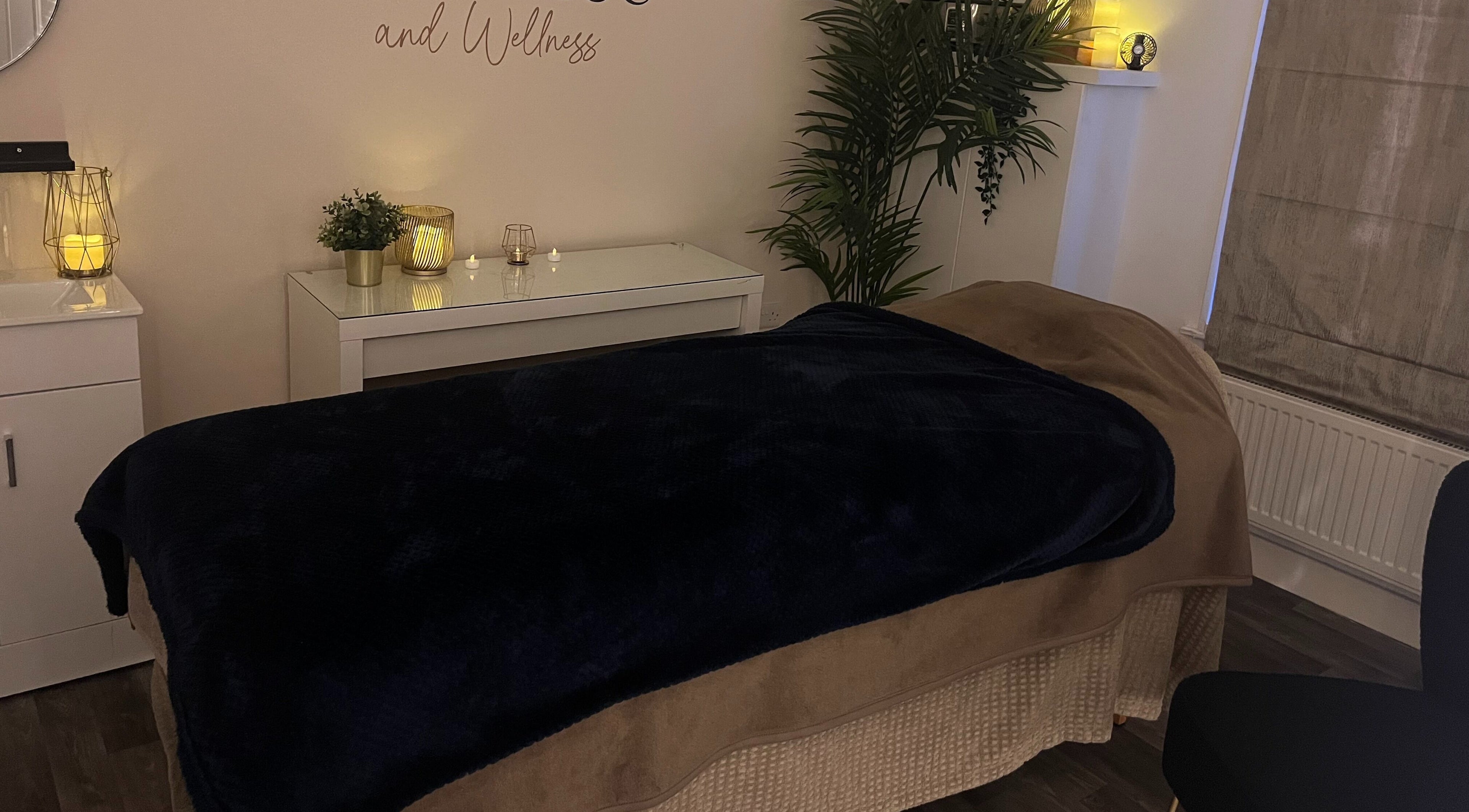 Relaxing spa room at Balance and Wellness, Preston, England, GB, featuring a cozy treatment bed and ambient lighting.