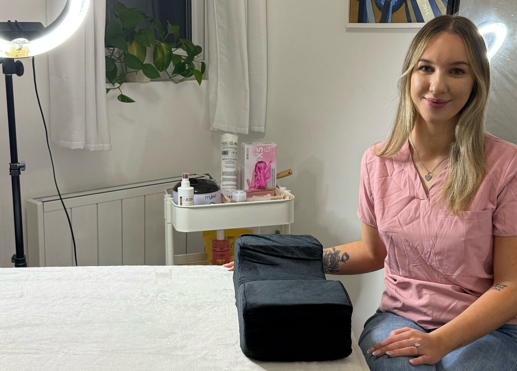 Beauty therapist at LBBK in High Wycombe, England, GB providing a welcoming atmosphere in a well-lit room.