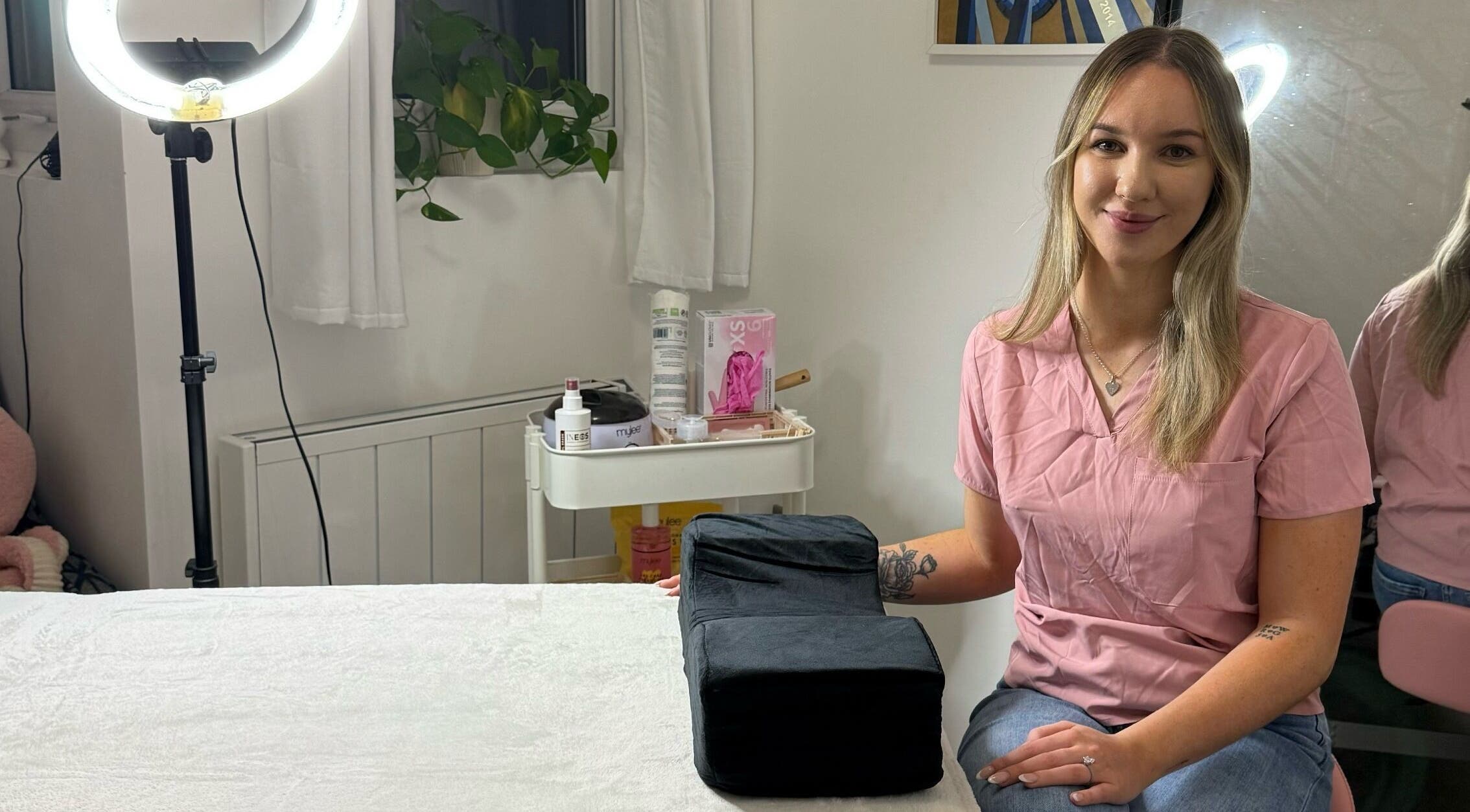 Beauty therapist at LBBK in High Wycombe, England, GB providing a welcoming atmosphere in a well-lit room.