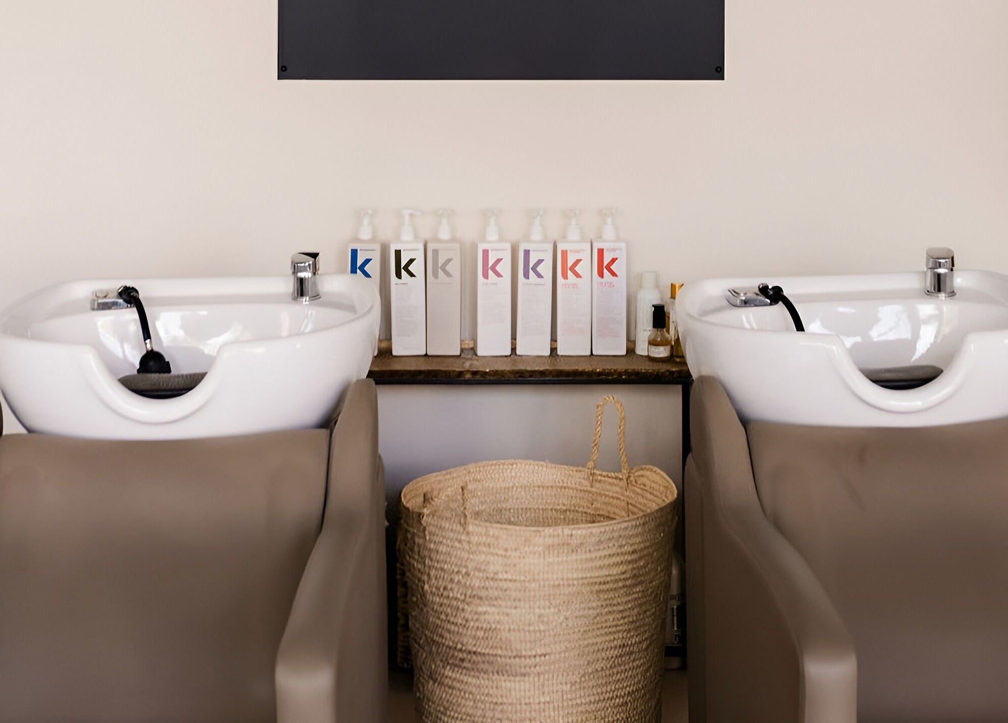 Elegant shampoo station at Odette Hair Studio, Prince Edward, Ontario, CA, with quality hair products.