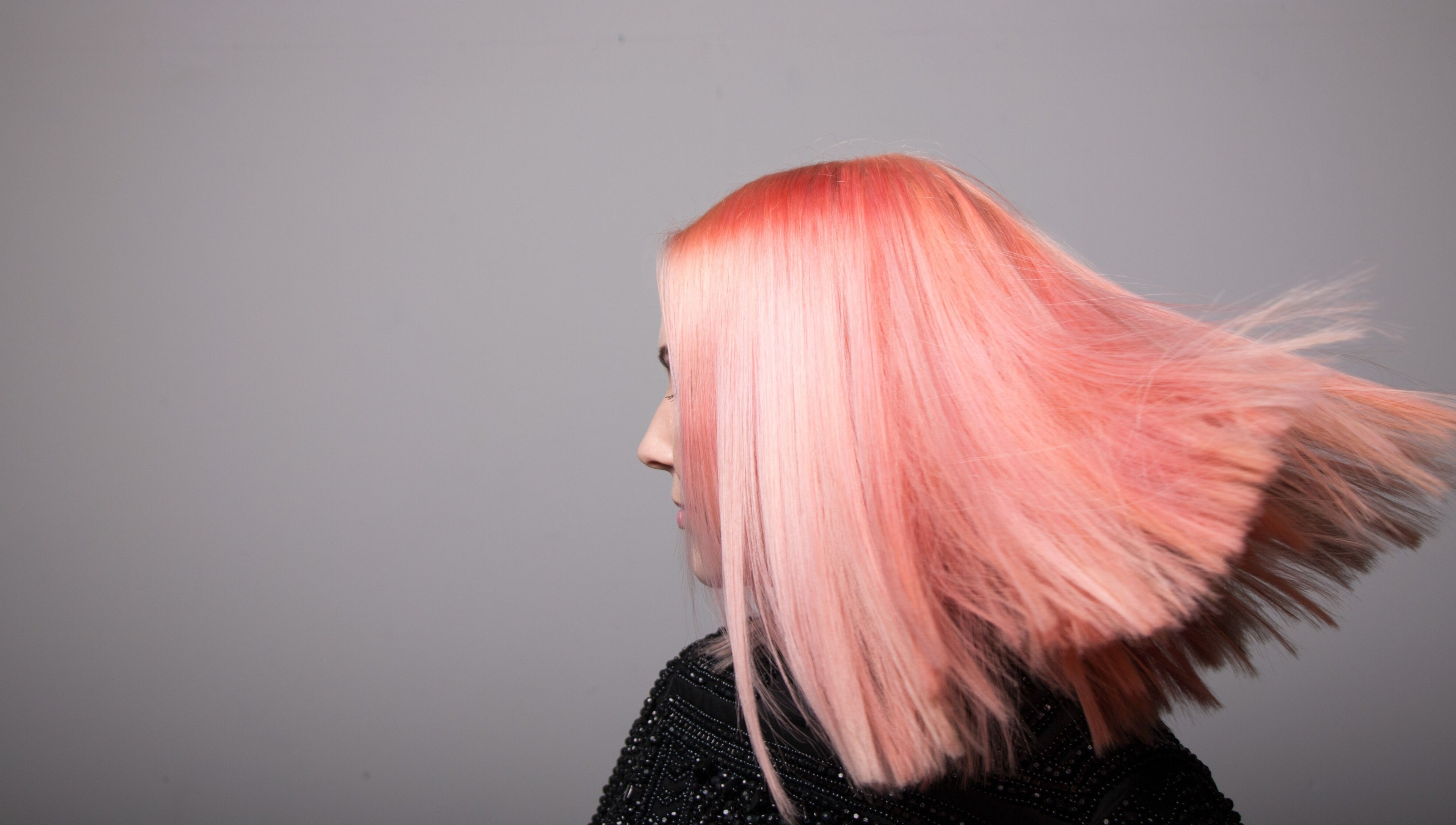 Vibrant pink hairstyle at Paint London salon, London, England. Experience bold beauty transformations.
