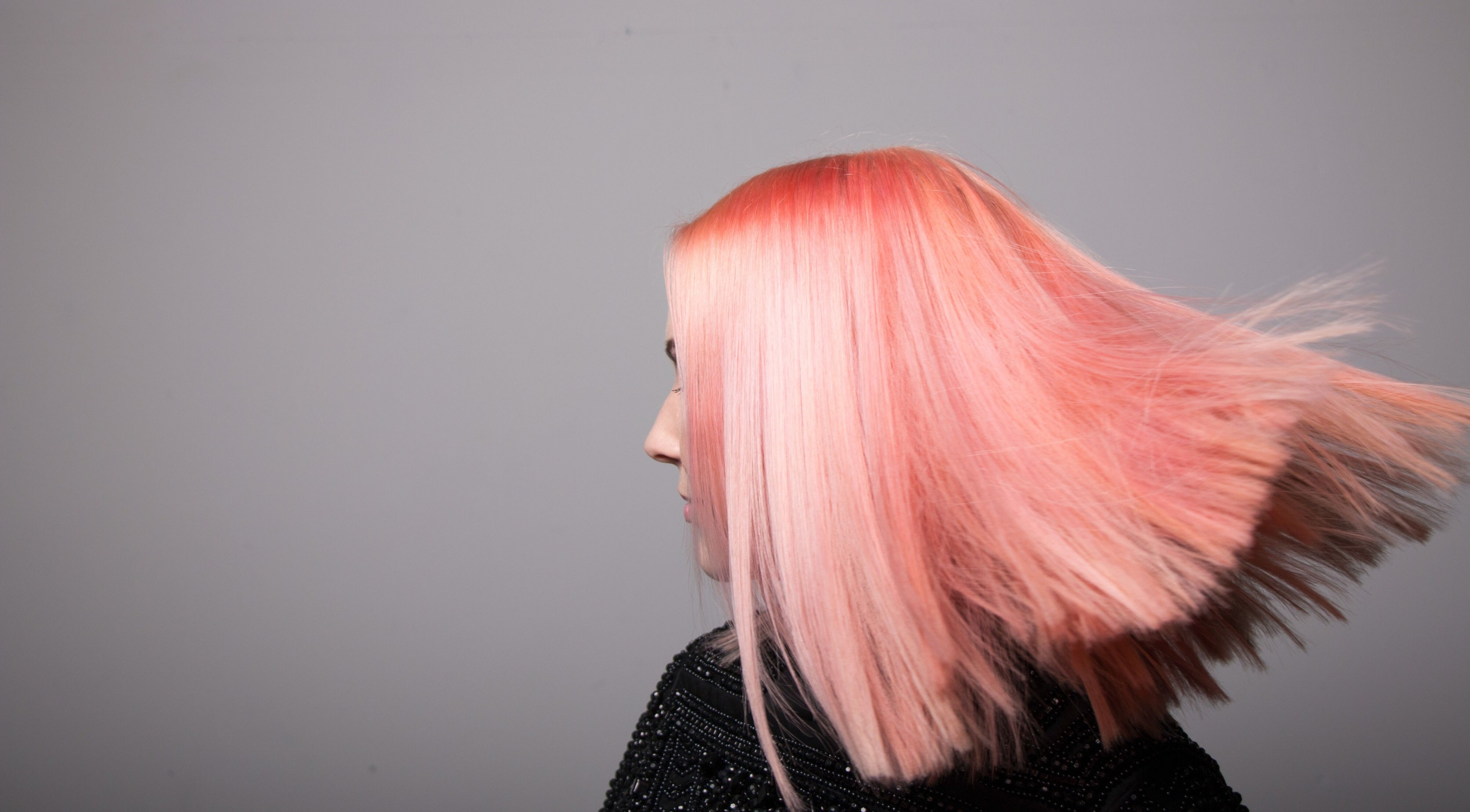 Vibrant pink hairstyle at Paint London salon, London, England. Experience bold beauty transformations.