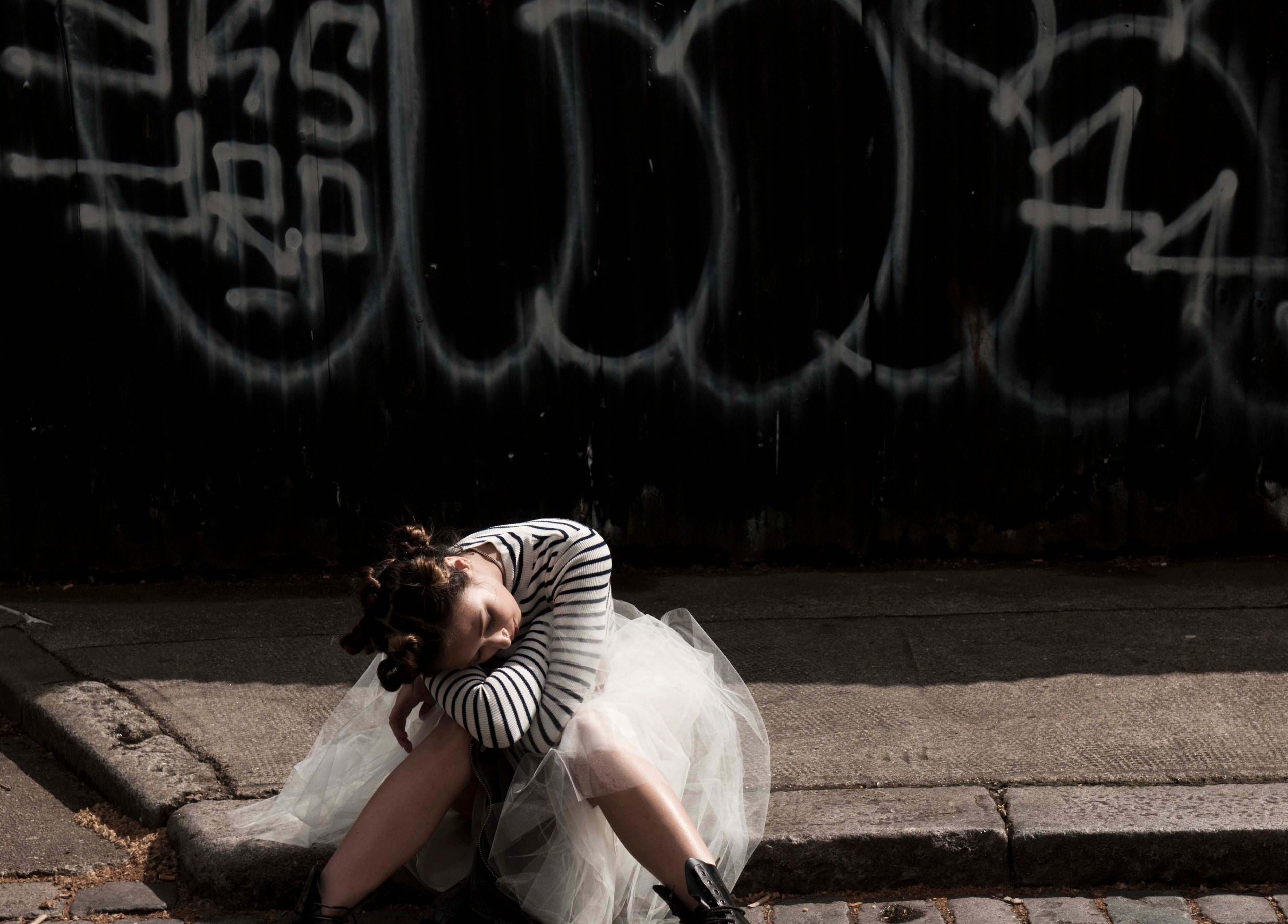 Fashionable woman in striped top and tulle skirt at Paint London, London, England, GB.