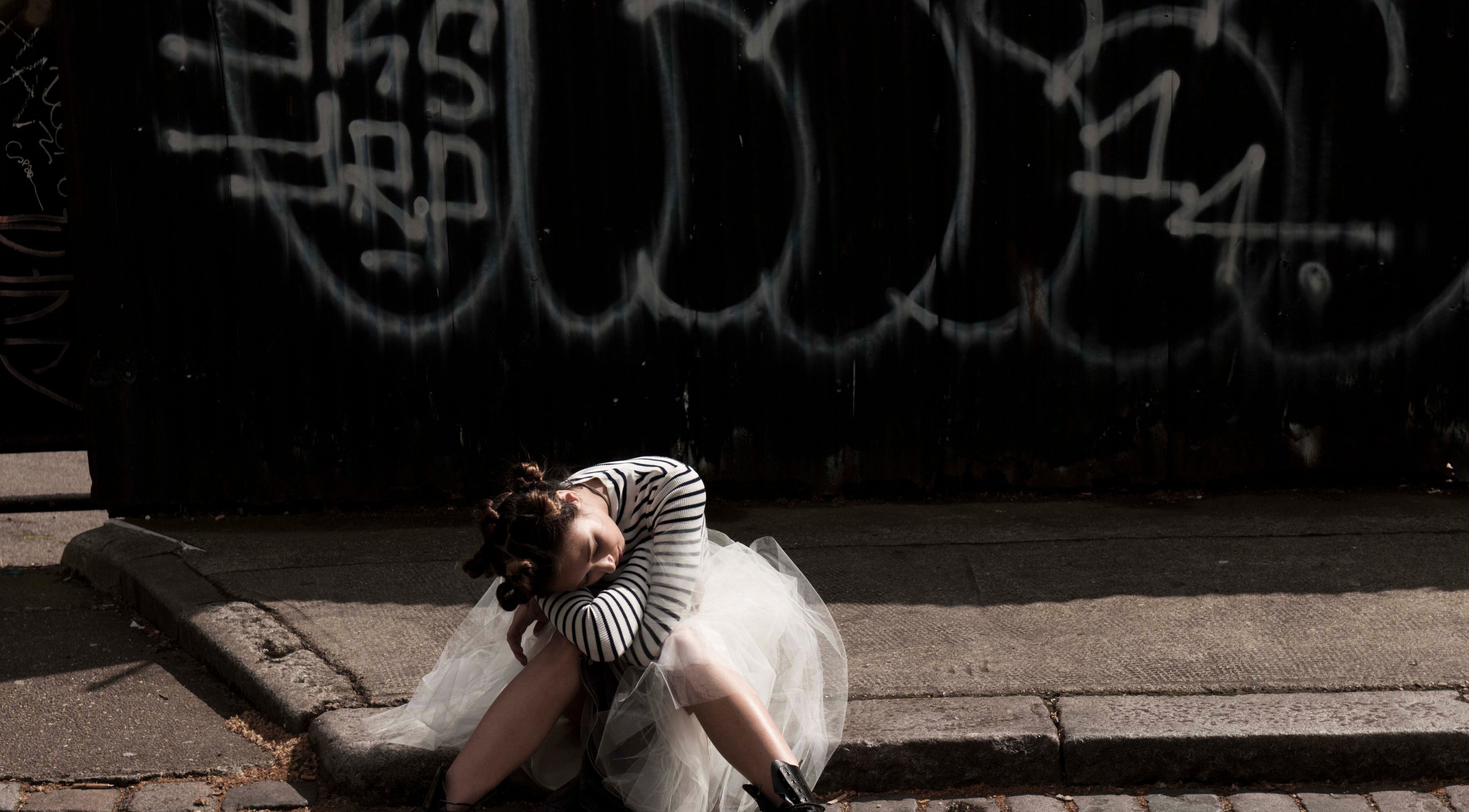 Fashionable woman in striped top and tulle skirt at Paint London, London, England, GB.