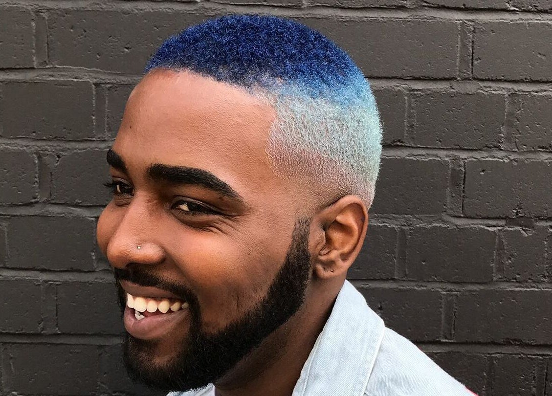Man with a fade haircut and blue ombre hairstyle at Paint London, London, England, GB.