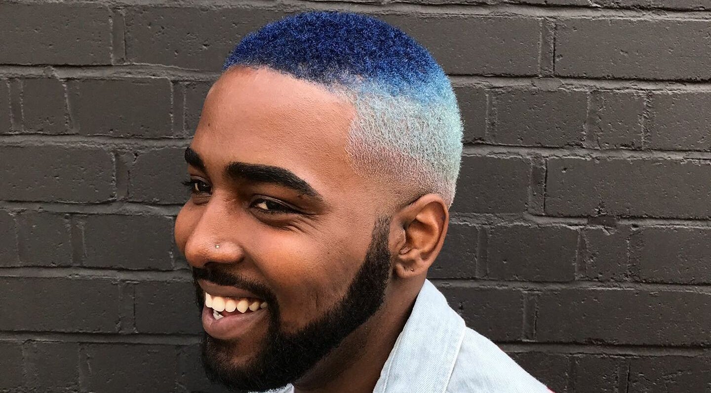 Man with a fade haircut and blue ombre hairstyle at Paint London, London, England, GB.