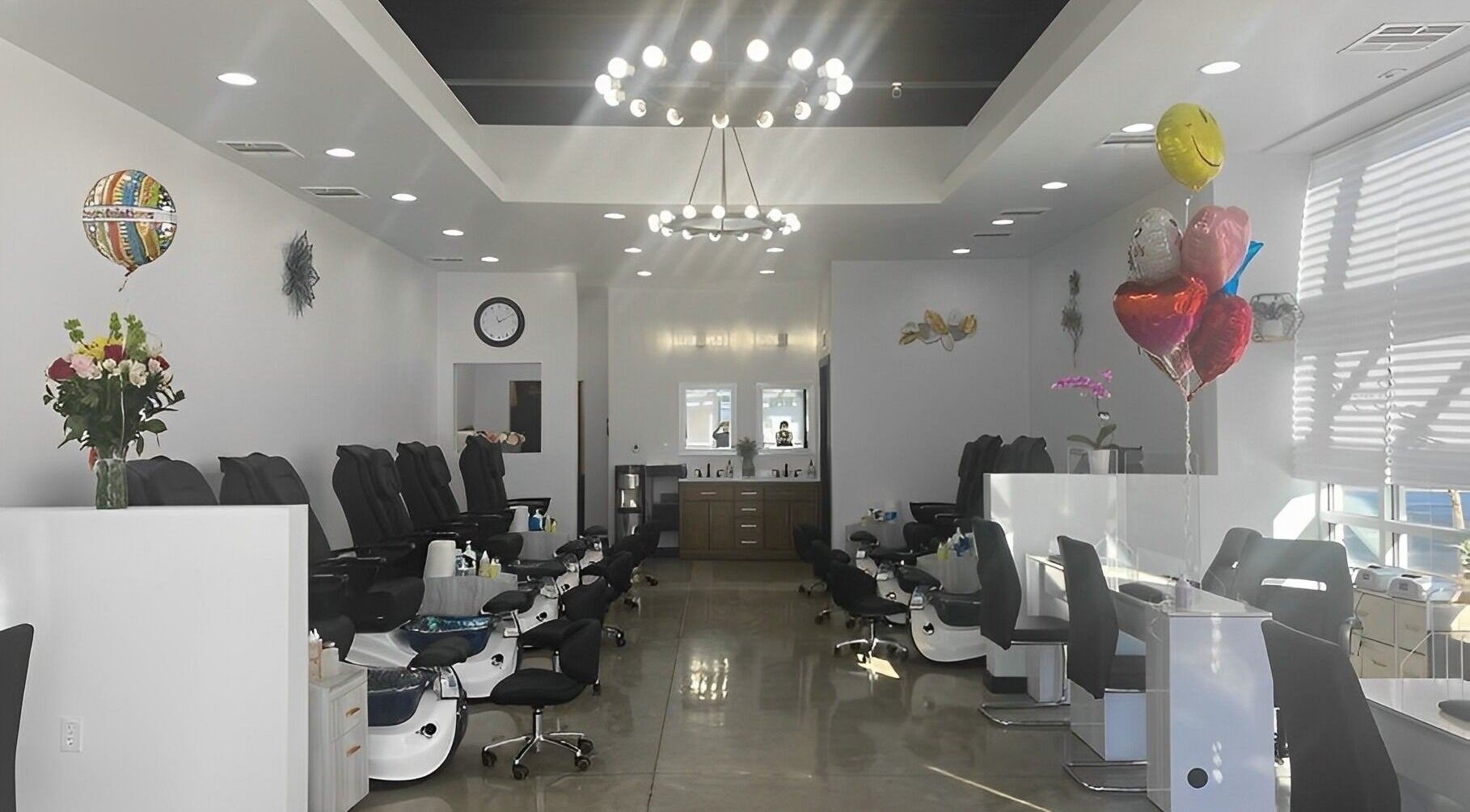 Chic nail salon interior at BTS Nails & Spa, Aurora, Colorado, US. Modern design with sleek chairs and soft lighting.