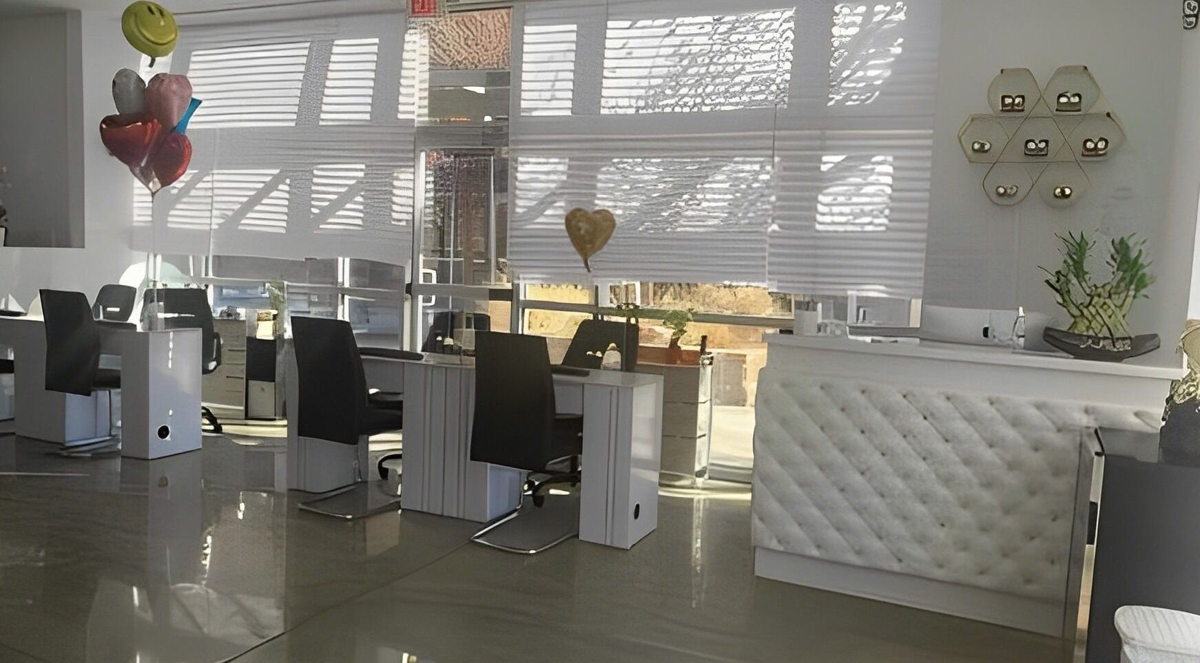 Elegant nail salon interior at BTS Nails & Spa in Aurora, Colorado, US featuring modern decor and workstations.