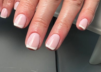 Elegant French manicure by Leila’s Beauty Lounge in Birmingham, England, GB.