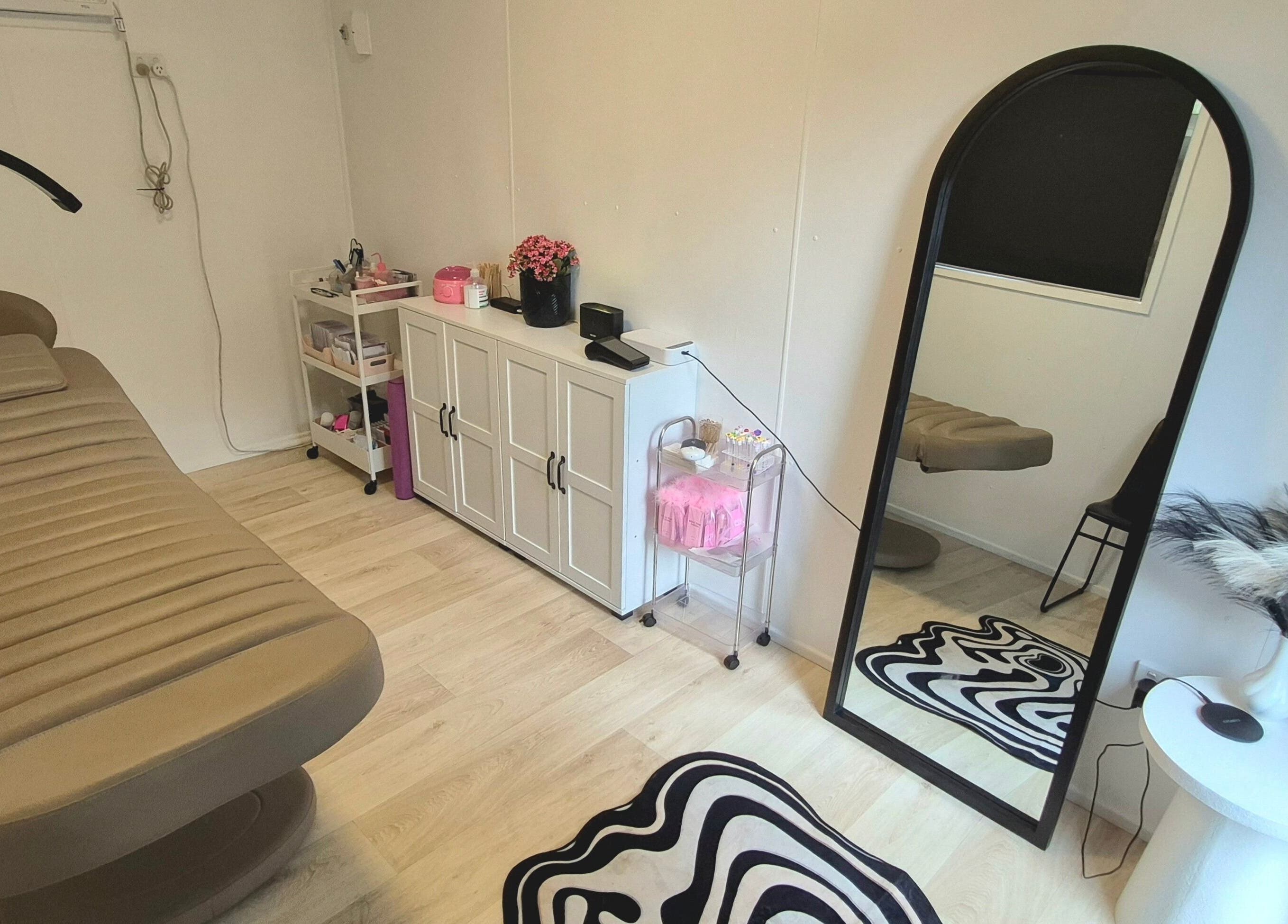 Tranquil treatment room at Lottie's Place - Loganlea, Queensland, AU with cozy decor and elegant furnishings.