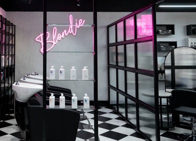 Modern salon interior at Flirt Hair and Beauty Bar in Pretoria, Gauteng, ZA with chic decor and hair products.