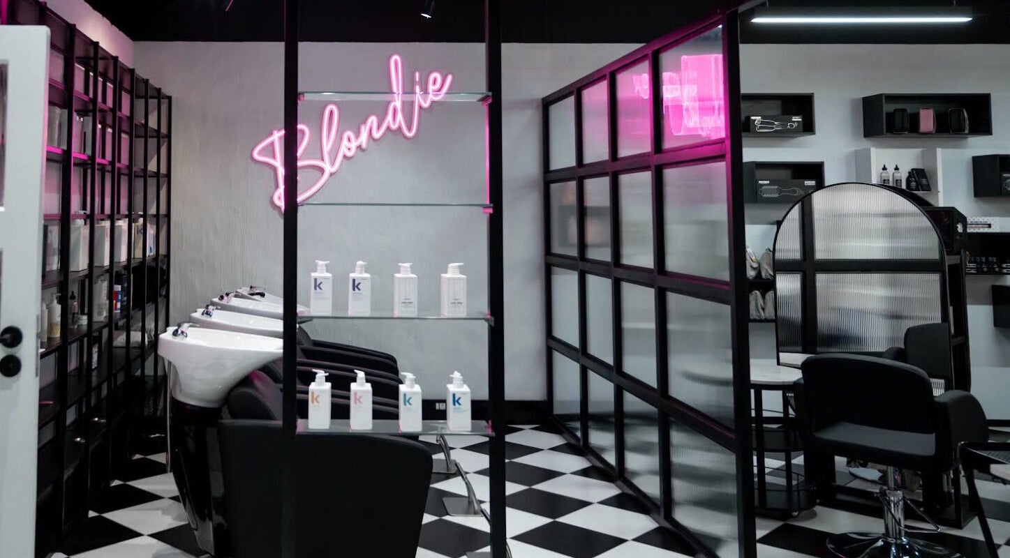 Modern salon wash stations at Flirt Hair and Beauty Bar, Pretoria, Gauteng, ZA with stylish decor and lighting.