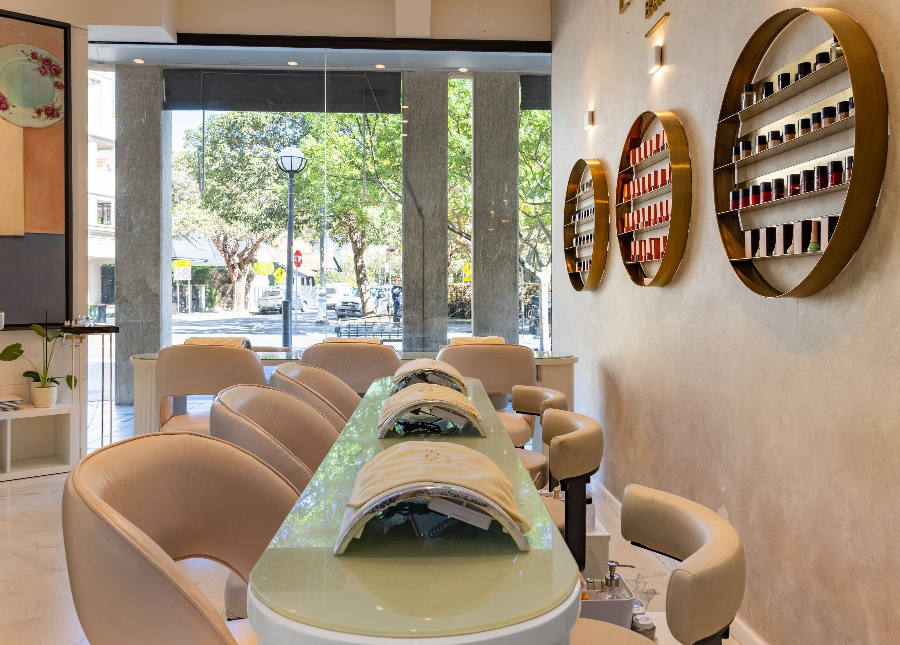Elegant interior of Laque Nail Bar - Double Bay, NSW, AU with sleek nail stations and vibrant polish display.