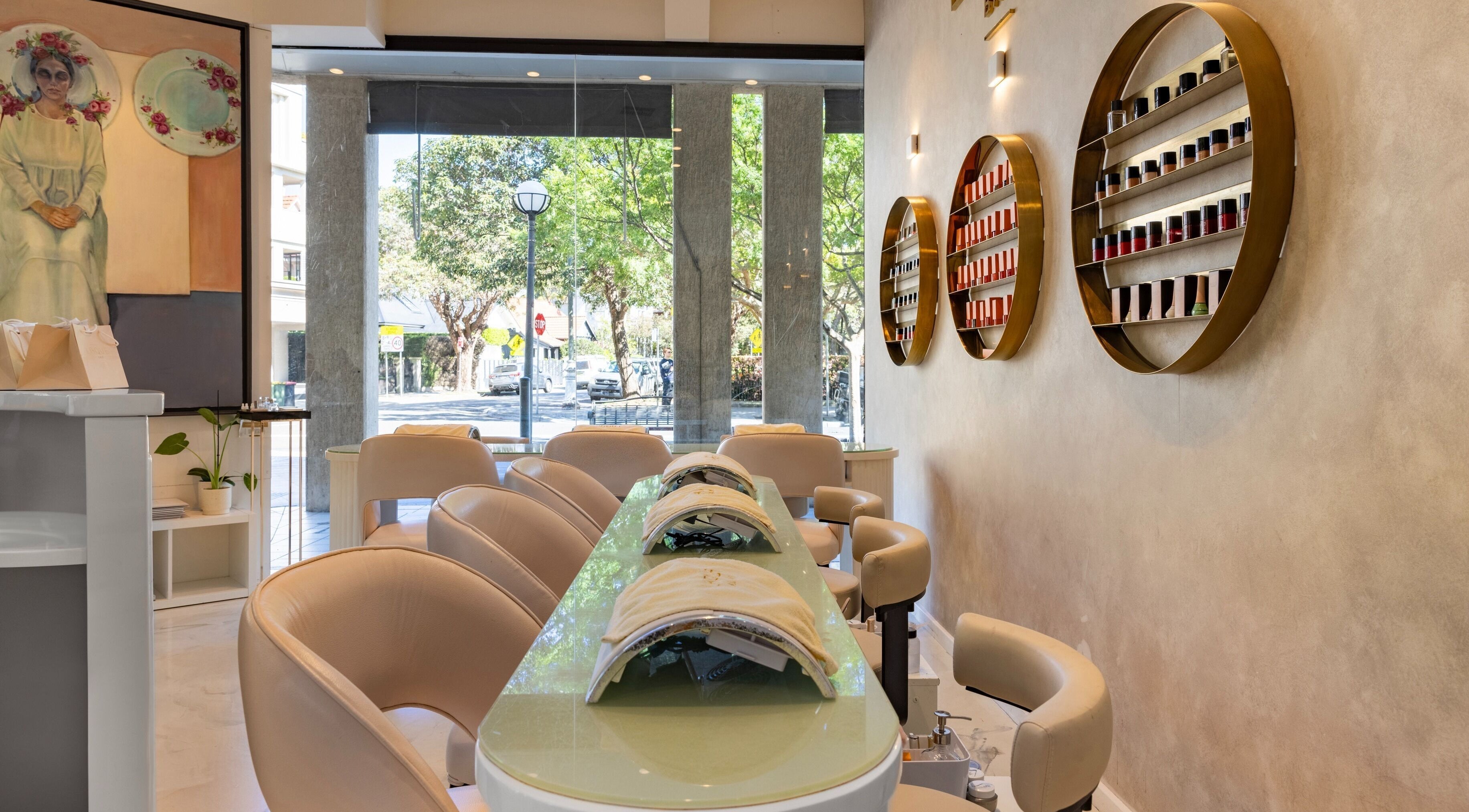 Elegant interior of Laque Nail Bar - Double Bay, NSW, AU with sleek nail stations and vibrant polish display.