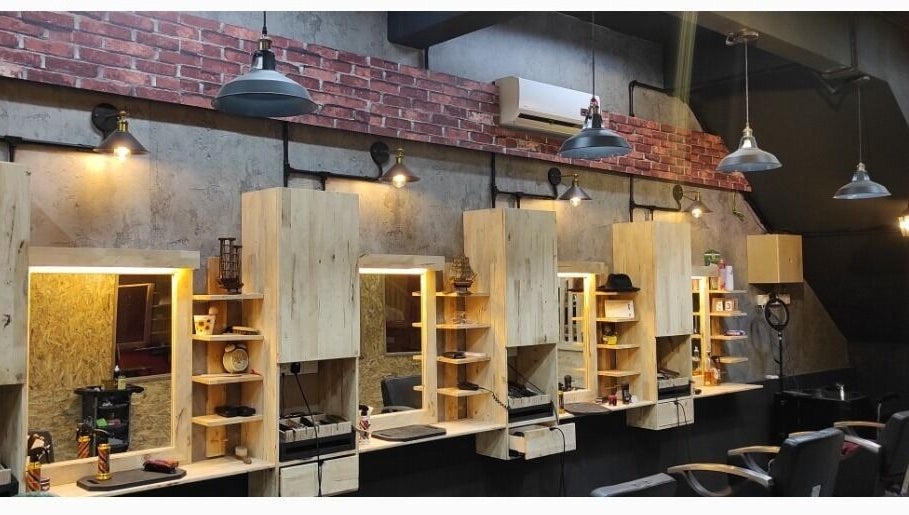 Modern interior of Barbossa Barbershop & Hairstylist in Kulim, Kedah, MY featuring stylish wooden workstations.