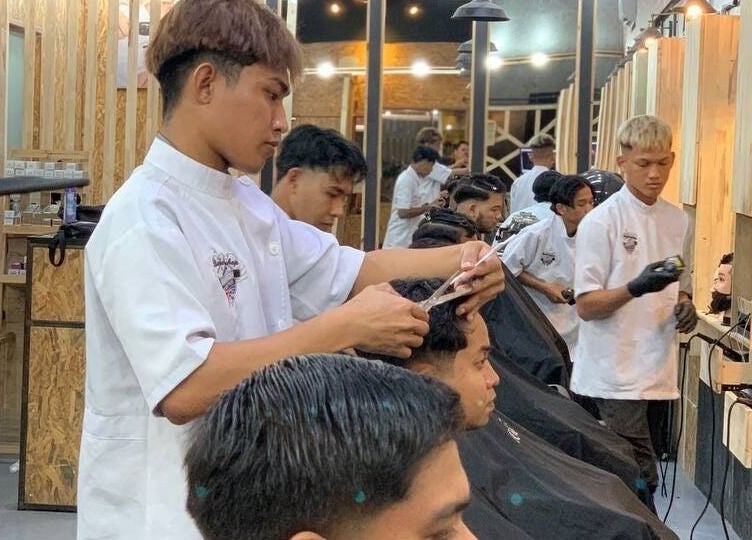 Barbers providing services at Barbossa Barbershop & Hairstylist in Kulim, Kedah, MY. Modern interior design.