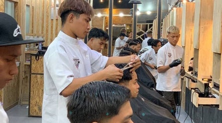 Barbers providing services at Barbossa Barbershop & Hairstylist in Kulim, Kedah, MY. Modern interior design.