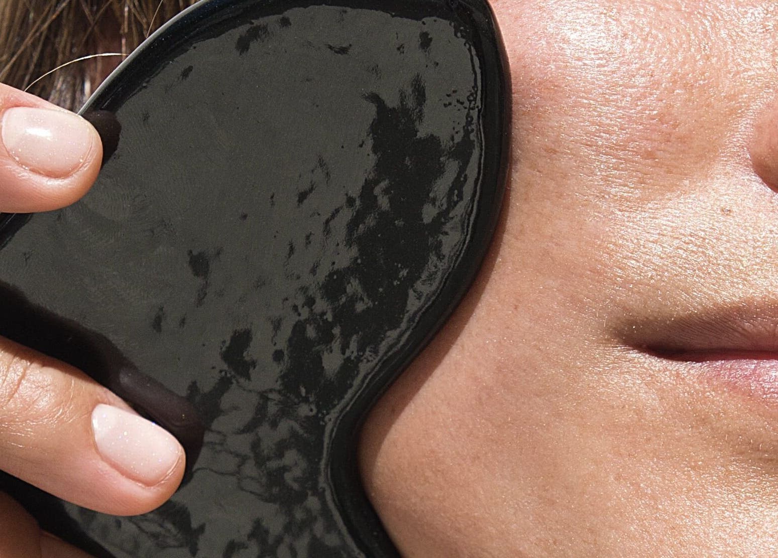 Gua Sha facial massage at Le Face Studio in Lisboa, Lisboa, PT, enhancing skin radiance naturally.