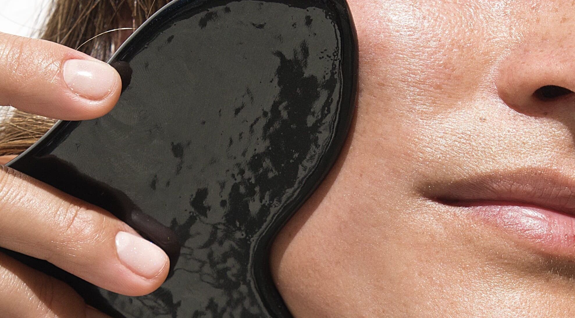 Gua Sha facial massage at Le Face Studio in Lisboa, Lisboa, PT, enhancing skin radiance naturally.