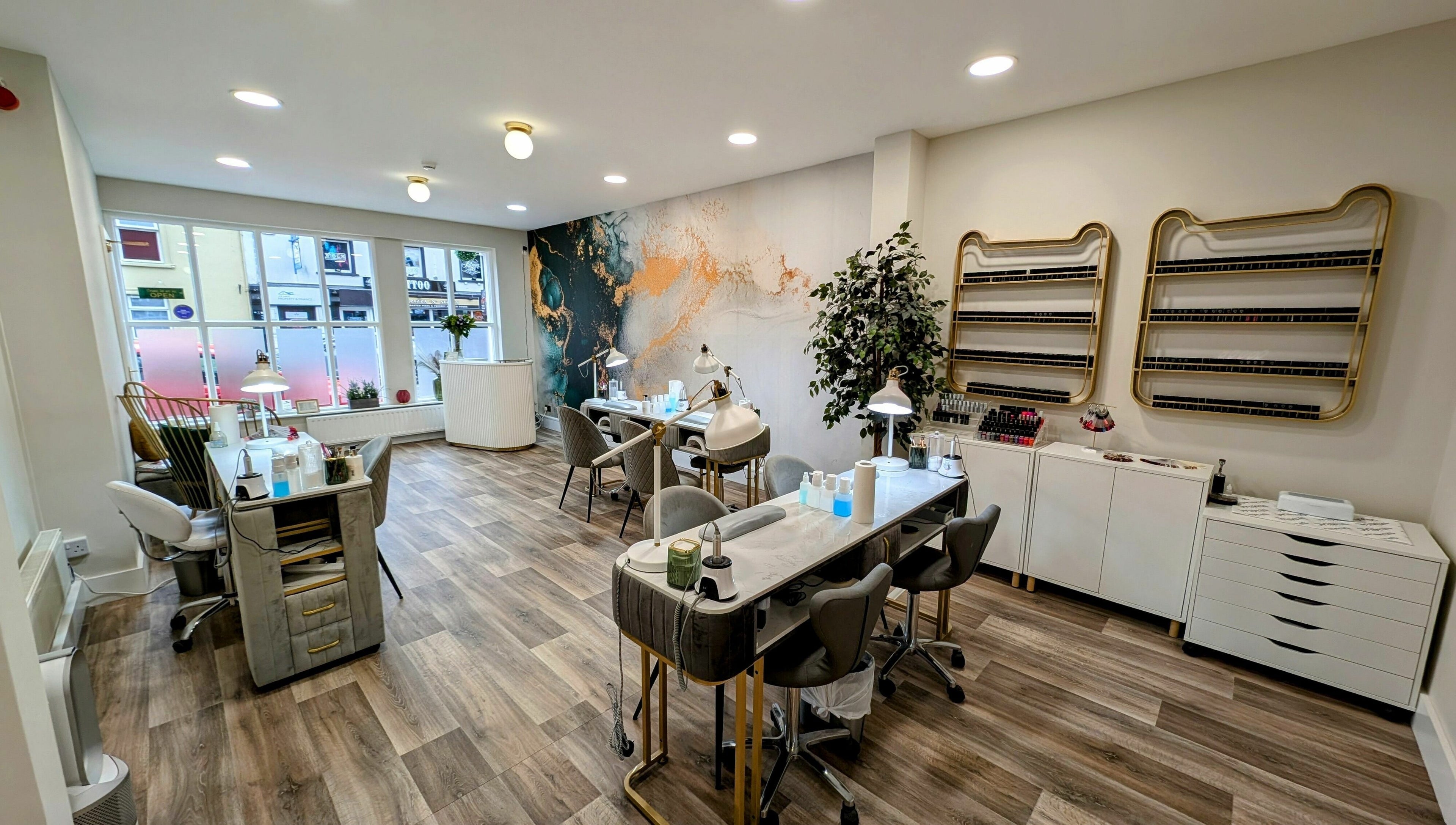 Modern interior of Mist Nail Bar in Carrigaline, County Cork, IE, featuring elegant nail stations.