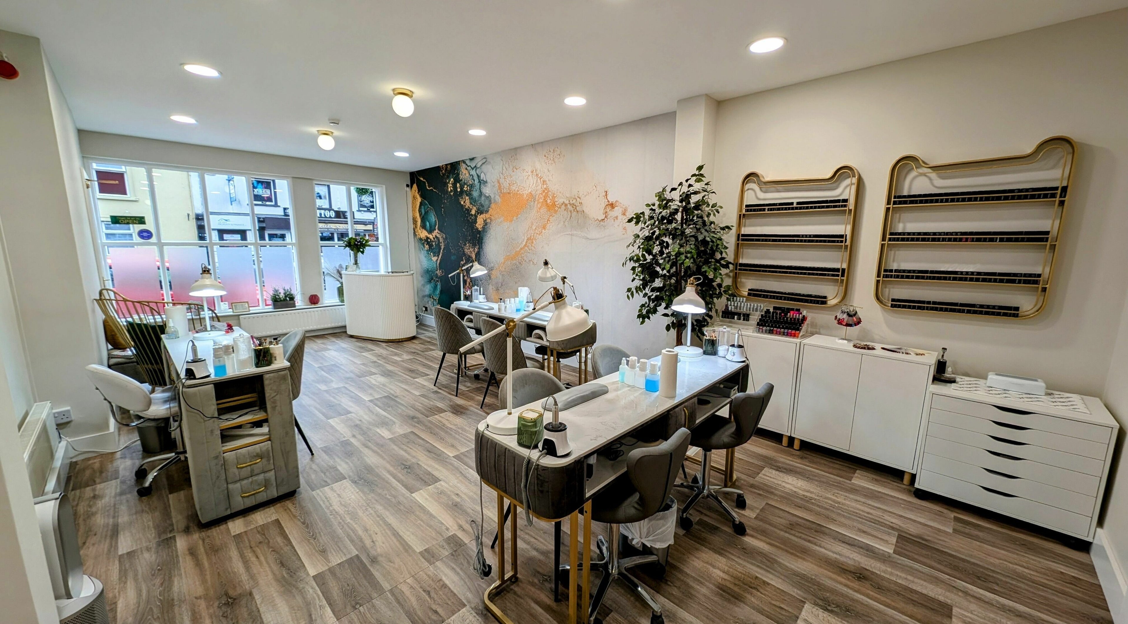 Modern interior of Mist Nail Bar in Carrigaline, County Cork, IE, featuring elegant nail stations.