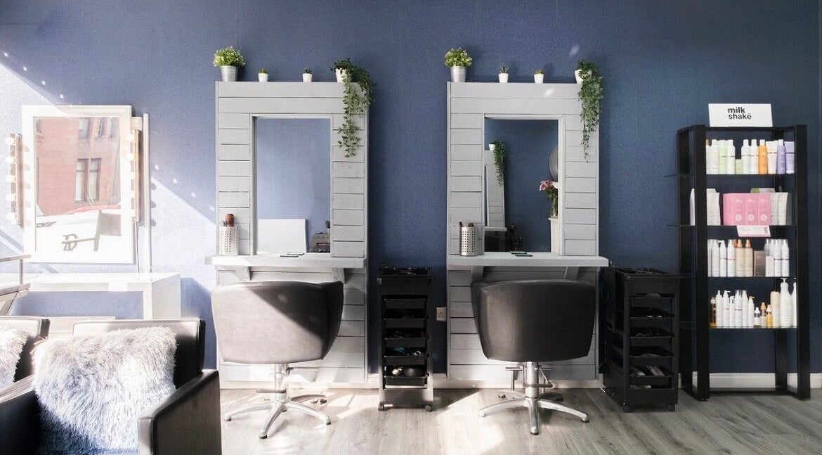 Elegant styling stations at Revive Hair, Beauty & Aesthetics, Glasgow, Scotland, GB, showcasing modern design.