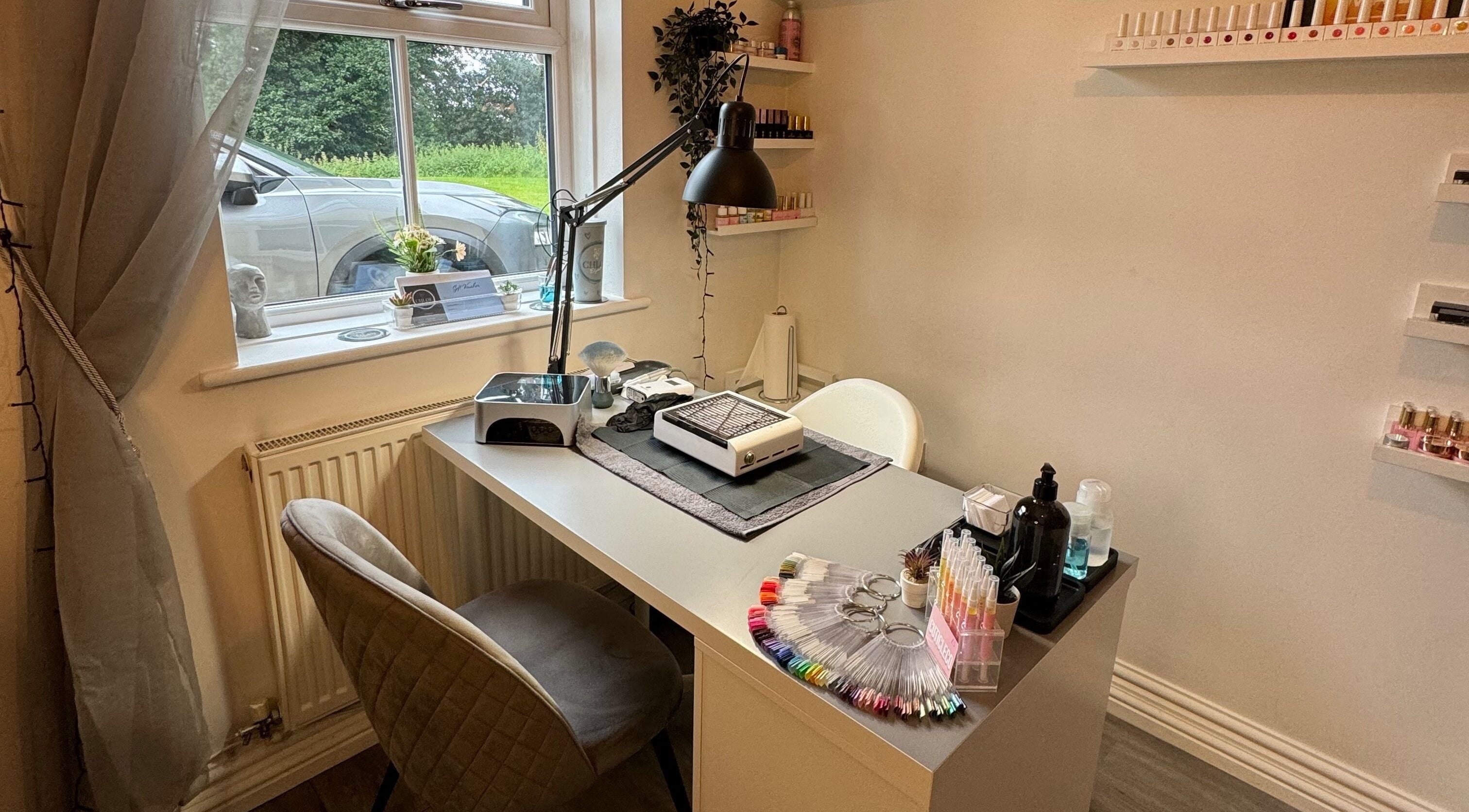 Chloe Elizabeth - Nails and Beauty's sleek nail station in Helsby, England, GB, with tools and nail polish display.