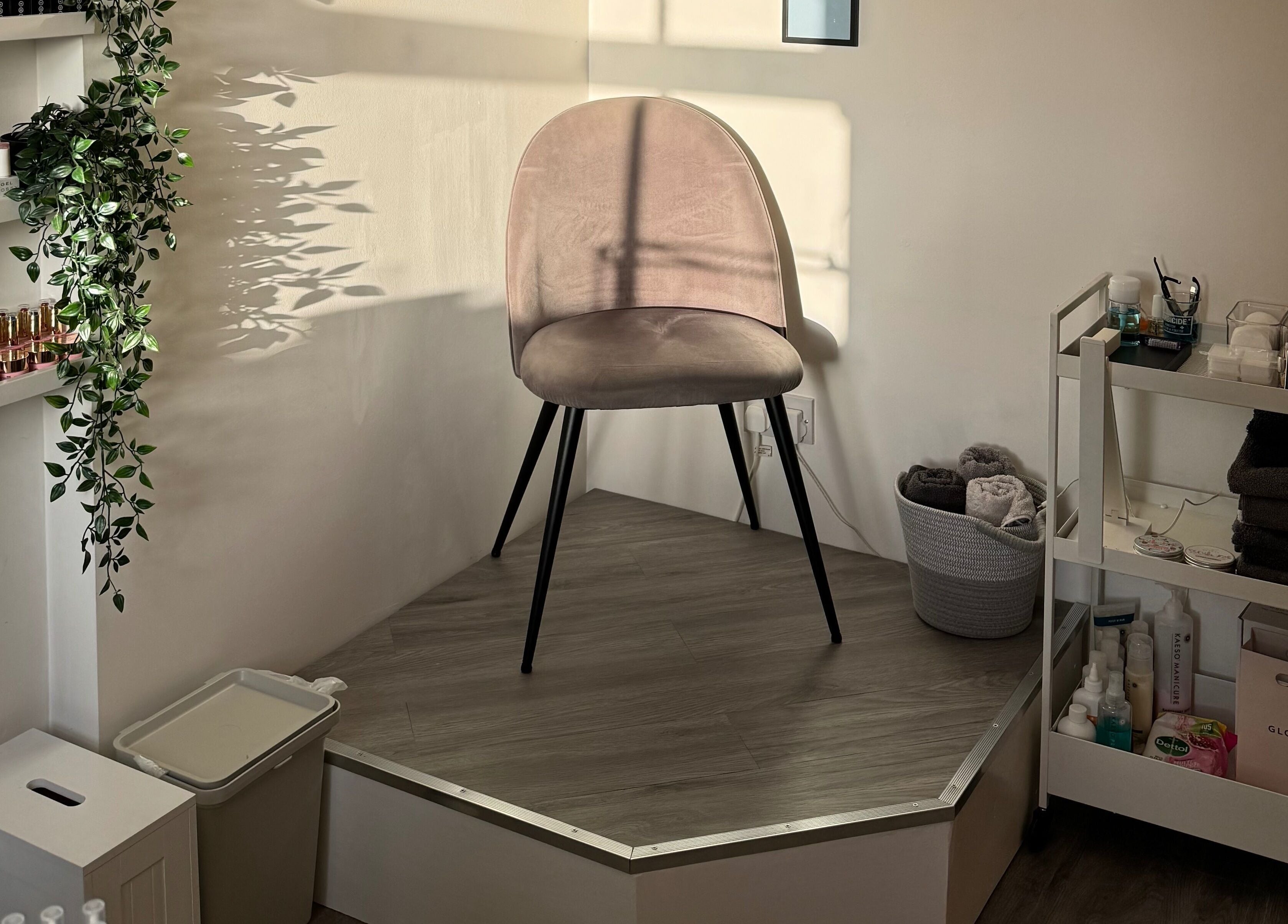 Cozy seating area at Chloe Elizabeth - Nails and Beauty, Helsby, England, GB with beauty products and elegant chair.