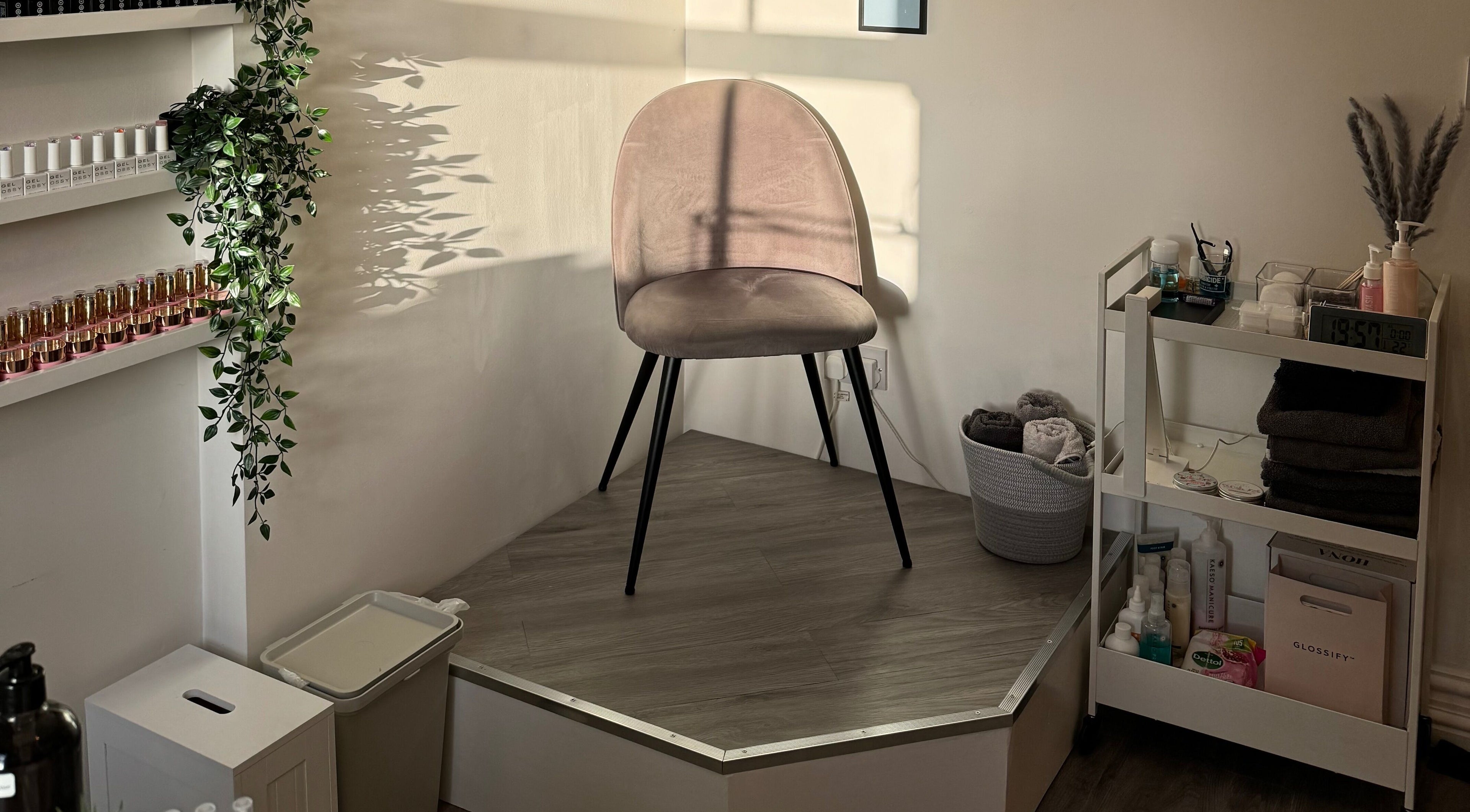 Cozy seating area at Chloe Elizabeth - Nails and Beauty, Helsby, England, GB with beauty products and elegant chair.