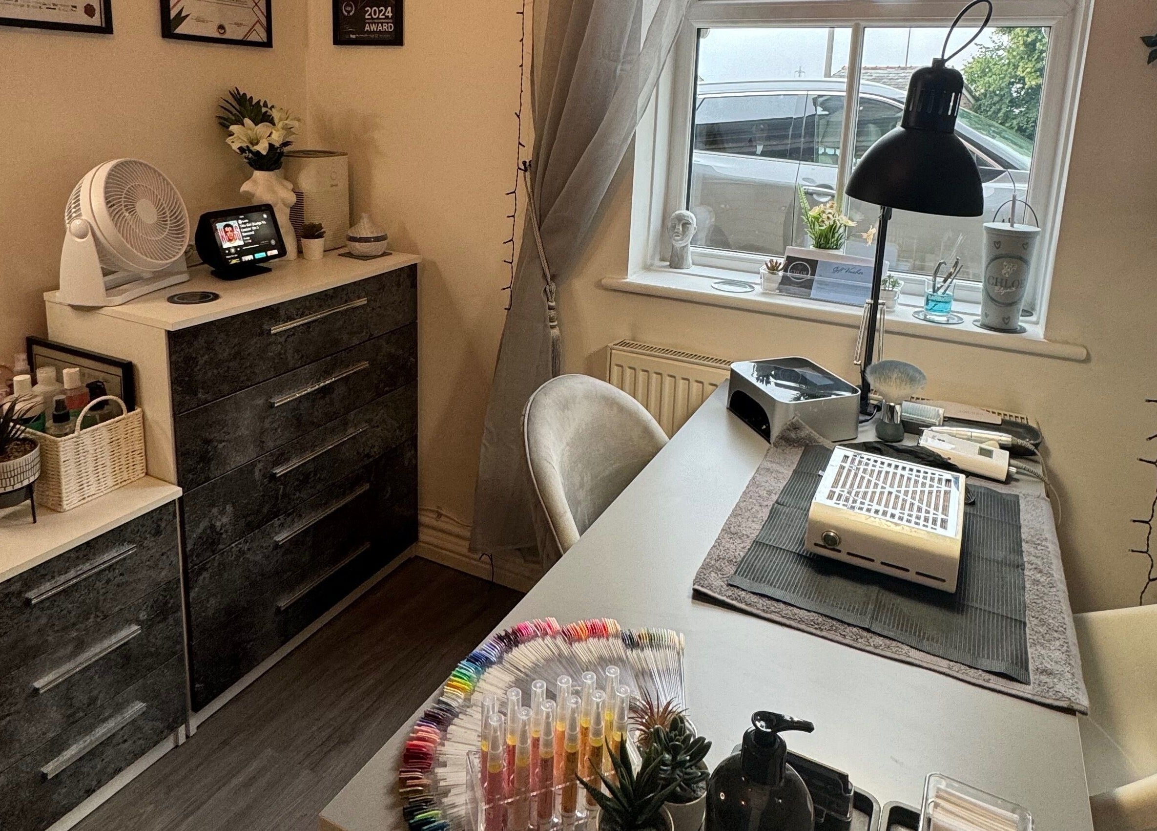 Modern nail station at Chloe Elizabeth - Nails and Beauty, Helsby, England, GB. Cozy decor and professional setup.